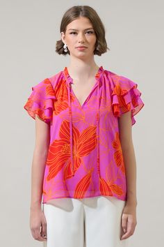 Add some statement prints to your new season wardrobe with this blouse. Featuring a pink and orange floral print with short layered sleeves, ruffle neck, and split neckline. It has an adjustable tie around the neck and maintains a classic fit. Wear it tucked into pants or shorts to go along. - Ruffle trim- Split neck- Neck tie- Ruffle layered sleeves- Color: Orange Pink MultiSize + Fit - Model is 5'8" and wearing size XS- Measurements taken from size S - Chest: 20"- Length: 24 1/2" Fabric Self: Flowy Tie Neck Top For Summer, Pink Floral Print Short Sleeve Blouse, Pink Short Sleeve Blouse With Floral Print, Short Sleeve Pink Blouse With Floral Print, Summer Floral Print Tie Neck Top, Summer Printed Tie Neck Tops, Printed Tie Neck Tops For Summer, Summer Tie Neck Blouse With Ruffles, Pink Ruffled V-neck Blouse