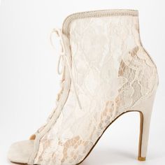 These Sweet Booties Are The Perfect Way To Transition Into Spring! Features An Open Toe Paired With A Closed Back. A Lace Upper And A Lace Up Front. Single Sole Styling And A Stiletto Heel. Heel Height 3” Lace Almond Toe Heels, Spring High Heel With Lace Trim, Spring High Heels With Lace Trim, Spring Lace Heels With Pointed Toe, Cream Lace Open Toe Heels, Spring Lace Heels, Party Heels With Lace Trim, Lace-up Lace Heels, Fitted Lace Heels For Spring