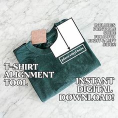 the t - shirt alignmentment tool is displayed in front of a white marble background