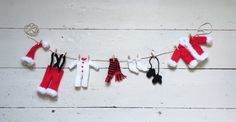 christmas stockings and hats hanging on a clothes line