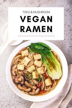 a bowl of vegan tofu ramen with noodles, mushrooms and green onions