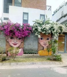 two brick wall paintings with flowers on them and one painted as a woman's face