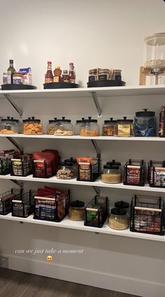 the shelves are full of food and condiments