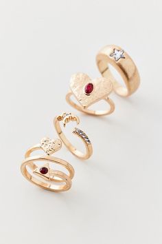 Set of four coordinating rings in a gold finish complete with rhinestone detailing. Features Rhea red rhinestone ring set Set of four coordinating rings Gold-tone rings with rhinestone detailing Set of four Content + Care Set of 4 Mixed metal, glass Avoid contact with water Imported | Rhea Red Rhinestone Ring Set in Gold, Women's at Urban Outfitters Preppy Rings, Rhinestone Ring, Rings Gold, Brand Sale, Red Rhinestone, Mixed Metals, Ring Set, Gold Finish, Ring Sets