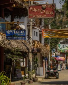 the street is lined with shops and restaurants