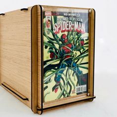 a wooden box with a spider - man comic cover on it's front and sides