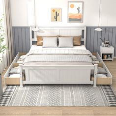 a white bed sitting on top of a wooden floor