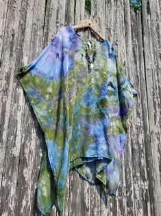 MONET Ice Dye Mini Kaftan, Beach Poncho or Tunic,  Regular or Plus Color Combo Name: ICE DYE MONET green-blue (looks like purple) Modeled in another color combo - a size Regular. I am 5'3", a size small. NECKLACE: See my Jewelry Section! This poncho/mini kaftan has a V-neckline and an armhole opening on the sides. The fabric is pre-shrunk super soft 100% woven rayon fabric. No need to iron it out of the dryer (I just dyed this beauty, and took it out of the dryer - it looks perfect!). Also, the wrinkles come out when hung for a while. 100% super-soft woven rayon Pre-Shrunk Machine wash and dry - the label calls for dry cleaning, but we have washed and dried it. Measurements:  REGULAR ONE SIZE;  Fits S-XL  41" wide -29½" between side stitching, 32" long PLUS ONE SIZE: 48" across, 37" across Tie Dye Product Ideas, Multicolor Poncho For Beach Cover-up In Summer, Purple Short Sleeve Kaftan For Beach, Hippie Multicolor Poncho For Beach, Blue Casual Poncho For Vacation, Casual Blue Poncho For Vacation, Multicolor Hippie Beach Poncho, Multicolor Poncho For Beach Cover-up, Multicolor Poncho For Summer Beach Cover-up