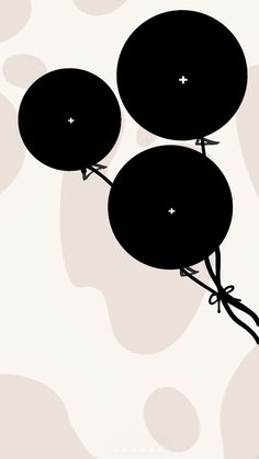 three balloons floating in the air on a white and black background with circles around them