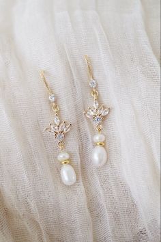 cubic zirconia freshwater pearl earrings 18k gold - Etsy #pearldangleearrings #pearldangle #pearldrop #dropearrings #dangleearrings #freshwaterpearl #bridalearrings #weddingearrings #earringsforbride #earringforbride #womensjewelry #elegantearrings #formalearrings #formalwearearrings #formalwearjewelry #bridejewelry #weddingjewellery #weddingjewelry #dangleearringspearl #golddangle #golddrop #cubiczirconia #uniqueearrings #earrings #earringsoftheday #earringsforwomen #earringstyle #jewelryforwom Long Wedding Earrings, Delicate Wedding Earrings, Floral Wedding Jewelry, Cinderella Earrings, Gold Dangle Earrings Wedding, Dangly Pearl Earrings, Vintage Wedding Earrings, Wedding Dangle Earrings, Pearl Wedding Jewelry