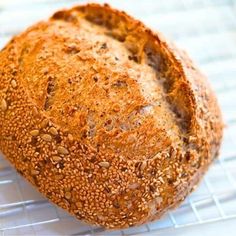 a loaf of bread sitting on top of a cooling rack