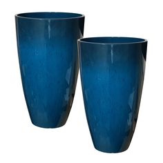 two blue vases sitting next to each other on a white background, one is empty