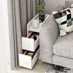 a living room scene with focus on the sofa and coffee cup in the storage drawer