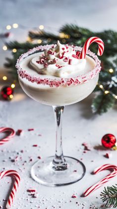 a christmas drink with candy canes and candies