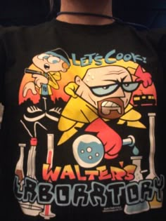 a person wearing a black shirt with cartoon characters on it