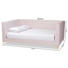 the bed is made up with a pink velvet frame and white sheets, along with two pillows