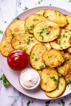 potato wedges on a plate with ketchup and mayonnaise