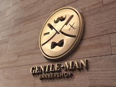 the gentleman barber shop is located on the side of the building and has a large sign that says gentlemen - man barbershop