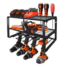 a black shelf with orange and black tools on it