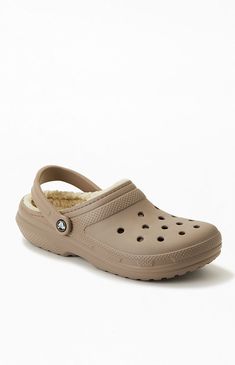 Add some versatile, comfy style and extra warmth to your daily look. The Classic Lined Clogs from Crocs feature an incredibly light fabrication, a pivoting heel strap for a secure fit, and a soft lining to keep your feet warm during the cold-weather months.

PLEASE NOTE: This shoe is offered in men's sizes; please consult the Size Guide above - the conversion is a size and a half smaller for women. For example, a woman who is a size 7.5 should order a size 6 in men's.


	Solid color de Nike Crocs, Fuzzy Crocs, Crocs Ideas, Lined Crocs, High School Fashion, Crocs Men, School Style, White Nike, Comfy Fashion