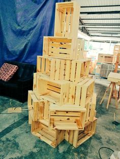 a pile of wooden crates sitting on top of a floor