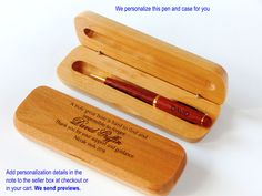 a pen in a wooden box with writing on it