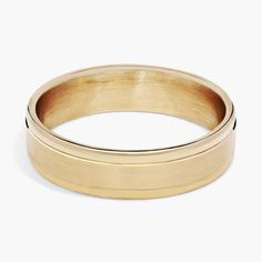 a gold ring on a white background