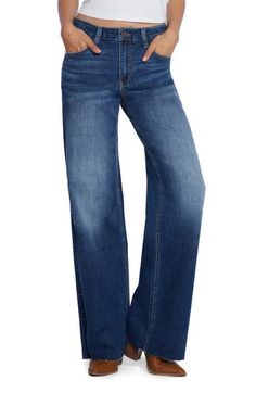 Effortlessly cool and relaxed, these mid-rise, full-length jeans are made from innovative stretch denim with lived-in fading and raw hems. 32" inseam; 19 1/2" leg opening; 9 1/2" front rise 67% cotton, 21% REPREVE® recycled polyester, 8% polyester, 3% rayon, 1% spandex REPREVE recycled polyester is made from 100% post-consumer recycled plastic bottles Machine wash, tumble dry Imported Denim Trucker Jacket, Trucker Jacket, Recycle Plastic Bottles, Black Tote Bag, Jeans Pants, Bottoms Pants, Boyfriend Jeans, Stretch Denim, Womens Bottoms