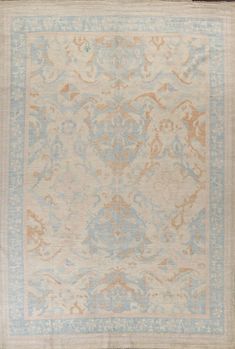 an antique rug with blue and beige colors