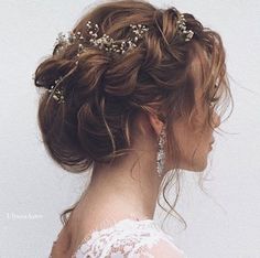 a woman with long hair wearing a wedding hairstyle