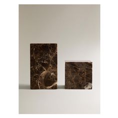 two pieces of marble sitting next to each other