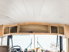 the inside of a camper that is being used as a living room and kitchen