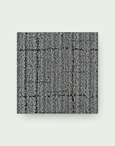 a gray and black rug on a white background