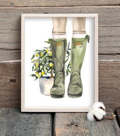 a watercolor painting of a pair of green rain boots next to a potted plant