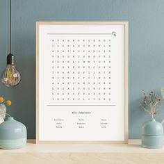 a framed word search print sitting on top of a table