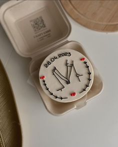 a cake in the shape of a clock on a tray