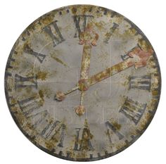 an old rusty clock with roman numerals on it's face and hands