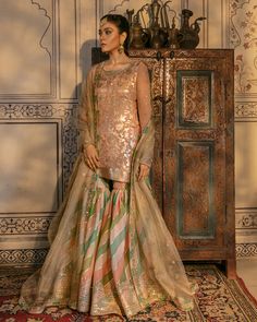 Buy Traditional Pakistani Wedding Gharara Dress in the alluring peach shade and premium fabric. This embroidered Gharara Kameez attire is available Online Wedding Gharara, Traditional Pakistani Wedding, Gharara Dress, Bridal Gharara, Faiza Saqlain, Gharara Designs, Anand Karaj, Song Lines, Shadi Dresses