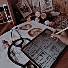 a doctor's office desk with various medical items on it, including an ipad and stethoscope