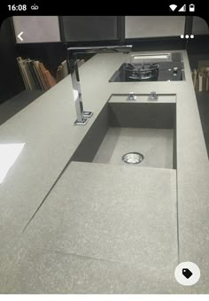 a kitchen counter top with a sink and stove