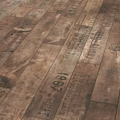 an old wooden floor with many different types of numbers on it and the words written in black