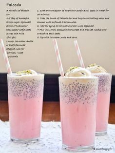 three glasses filled with ice cream and sprinkles on top of a table