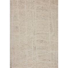 a beige rug with an abstract design on the top and bottom, it is very soft