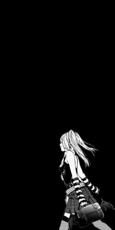 a girl with long hair walking in the dark