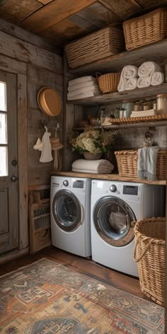 a washer and dryer in a small room with baskets on the shelves above