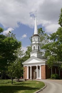 a small church with a steeple on the top