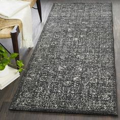 a black and white area rug in a living room