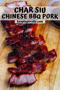 sliced up pork on a cutting board with sauce in the background and text overlay reading char siu chinese bbq pork