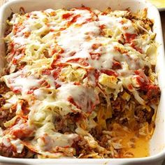 a casserole dish with meat, cheese and sauce