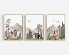 three framed paintings of animals in the woods